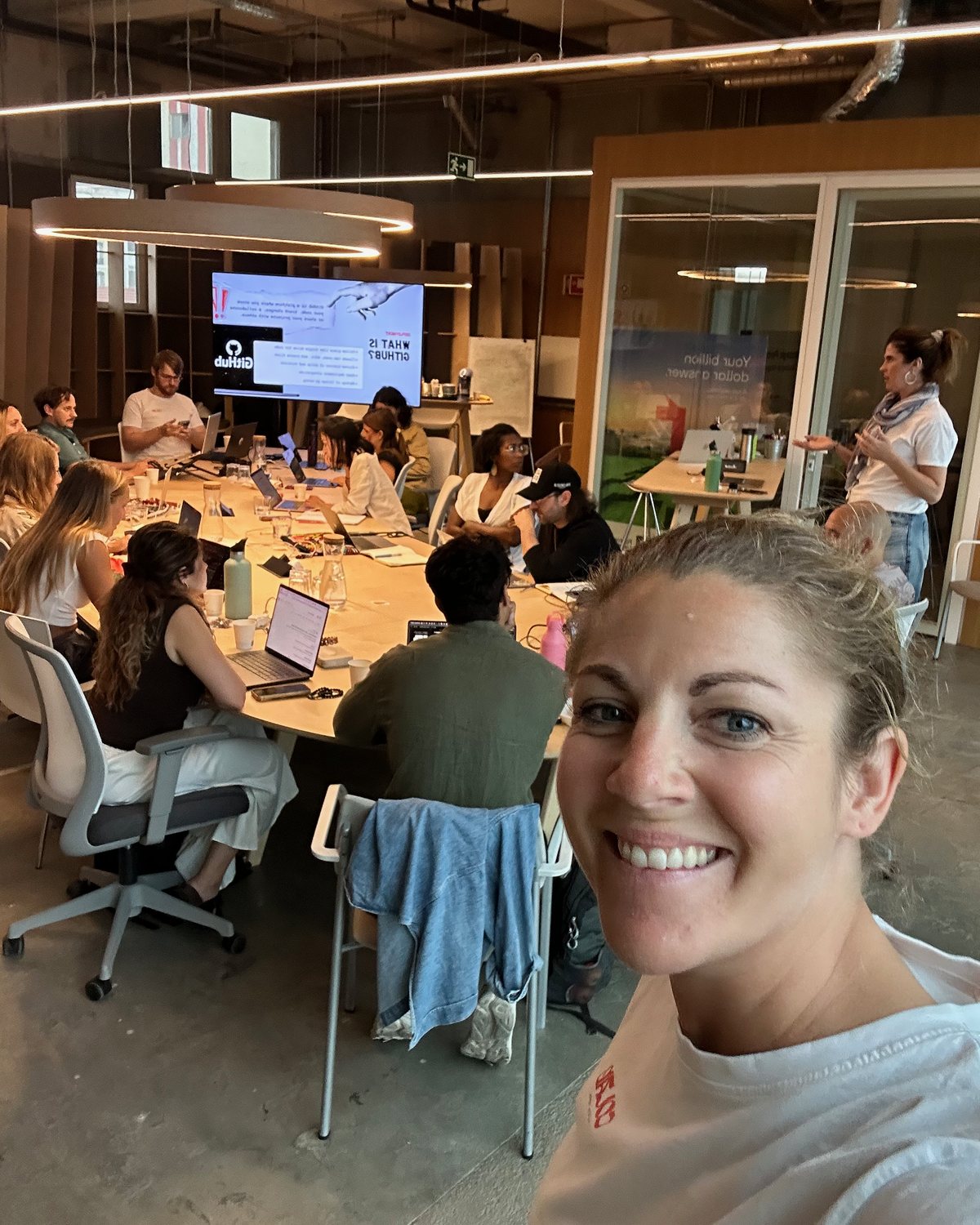 Verena taking a selfie in front of a CoLab workshop